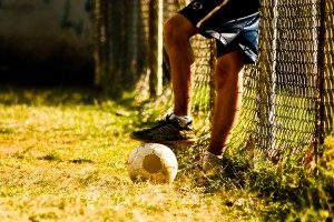 kid with foot on a soccer ball costa rica