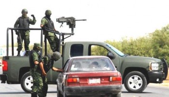 Mexican Soldiers at Checkpoint in 2009. Source: Wikimedia