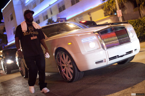 Rick Ross rollin' in his Rolls.
