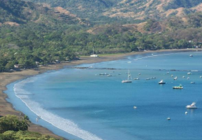 Dark sand beach of Playas del Coco