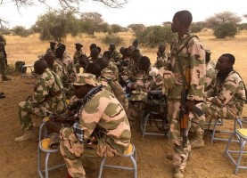 Nigerian soldiers during a mission briefing. Wikimedia Commons