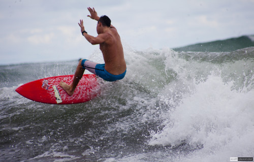 Dancing like Michael Jackson on the waves of the ocean.