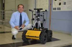 A man and his robot: Professor Geovanny Martinez Castillo. Source: UCR
