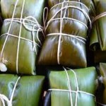 Costa Rican tamales wrapped in banana leaves
