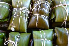 Costa Rican tamales wrapped in banana leaves