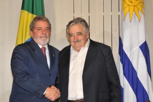 Former President Mujica, right, shakes hands with former President Lula of Brazil