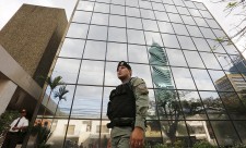 A police officer stands guard outside the Mossack Fonseca law firm office in Panama City April 12, 2016. REUTERS/Carlos Jasso